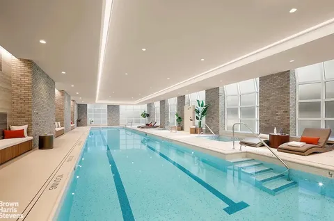 a large white kitchen with a large window