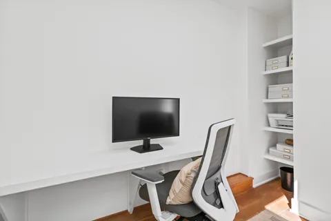 a view of a workspace with furniture