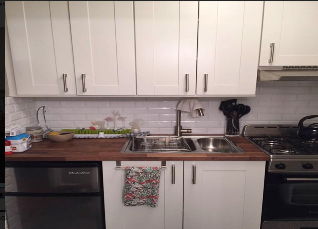 433 West 34th Street, Unit 6H Manhattan, NY 10001 - Photo 3 of 8 a kitchen with a sink and cabinets