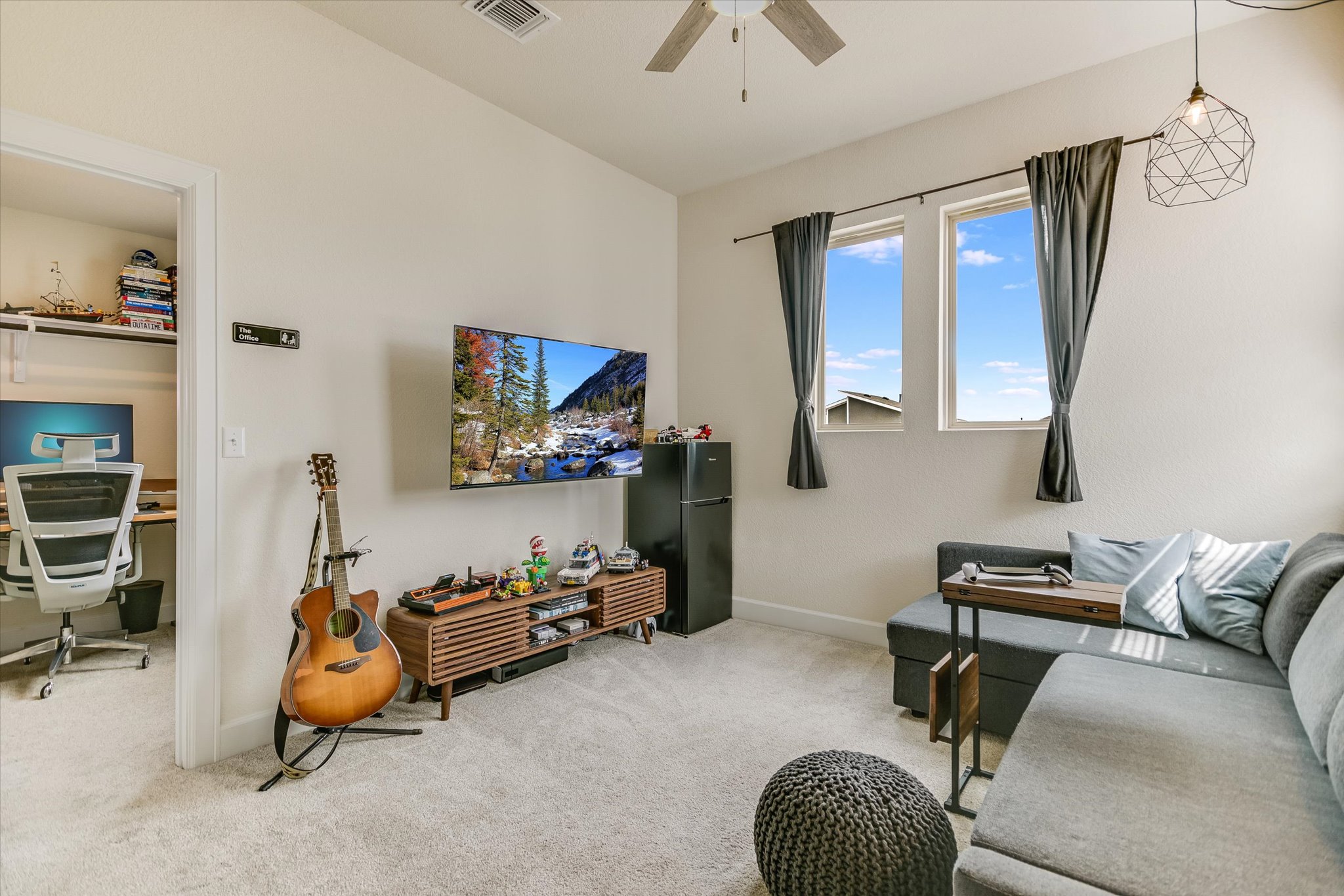 8607 McKamy Drive Austin, TX 78744 - Photo 19 of 28 a room with furniture and a flat screen tv