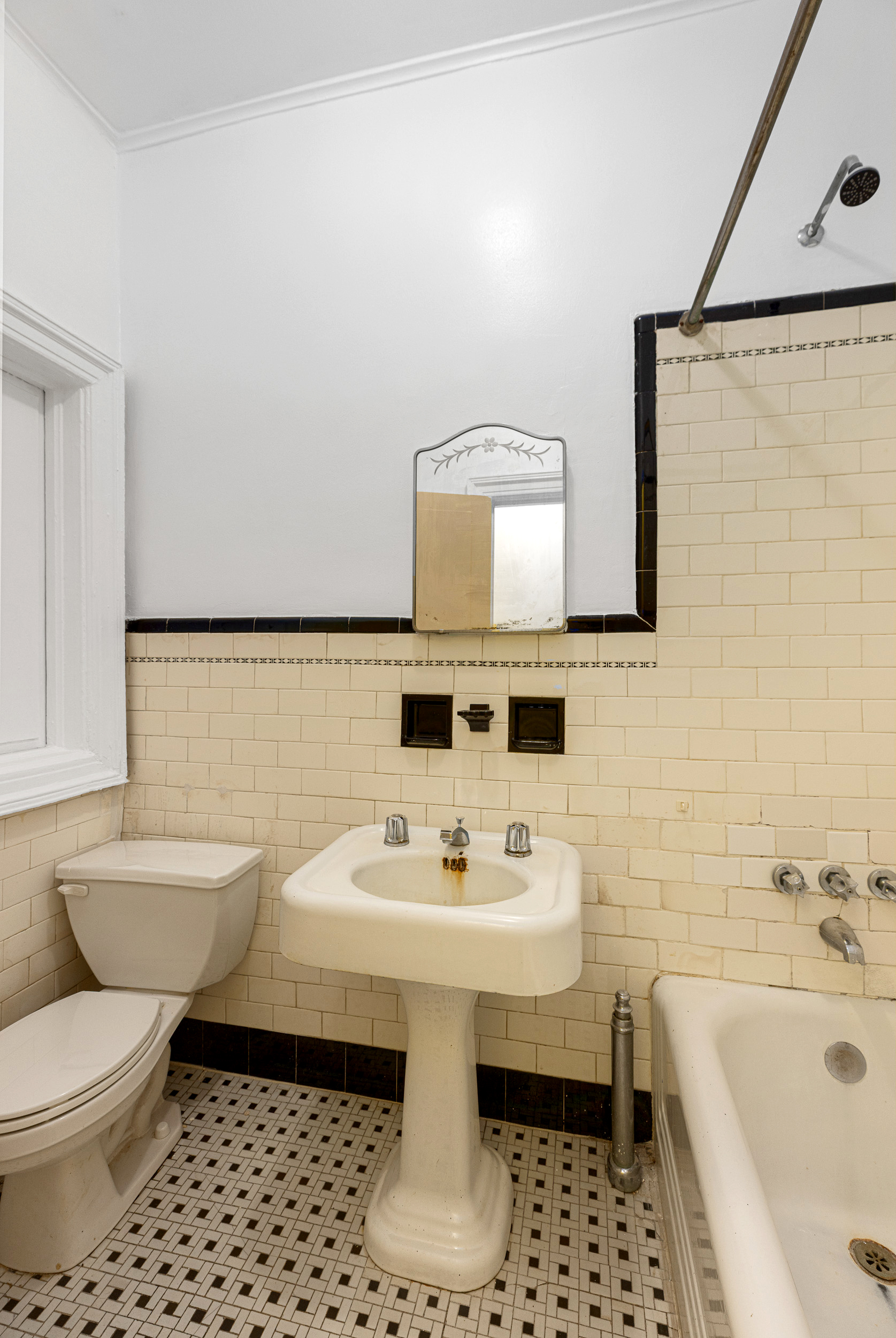 304 East 8th Street Brooklyn, NY 11218 - Photo 23 of 32 a bathroom with a sink toilet a mirror and bathtub