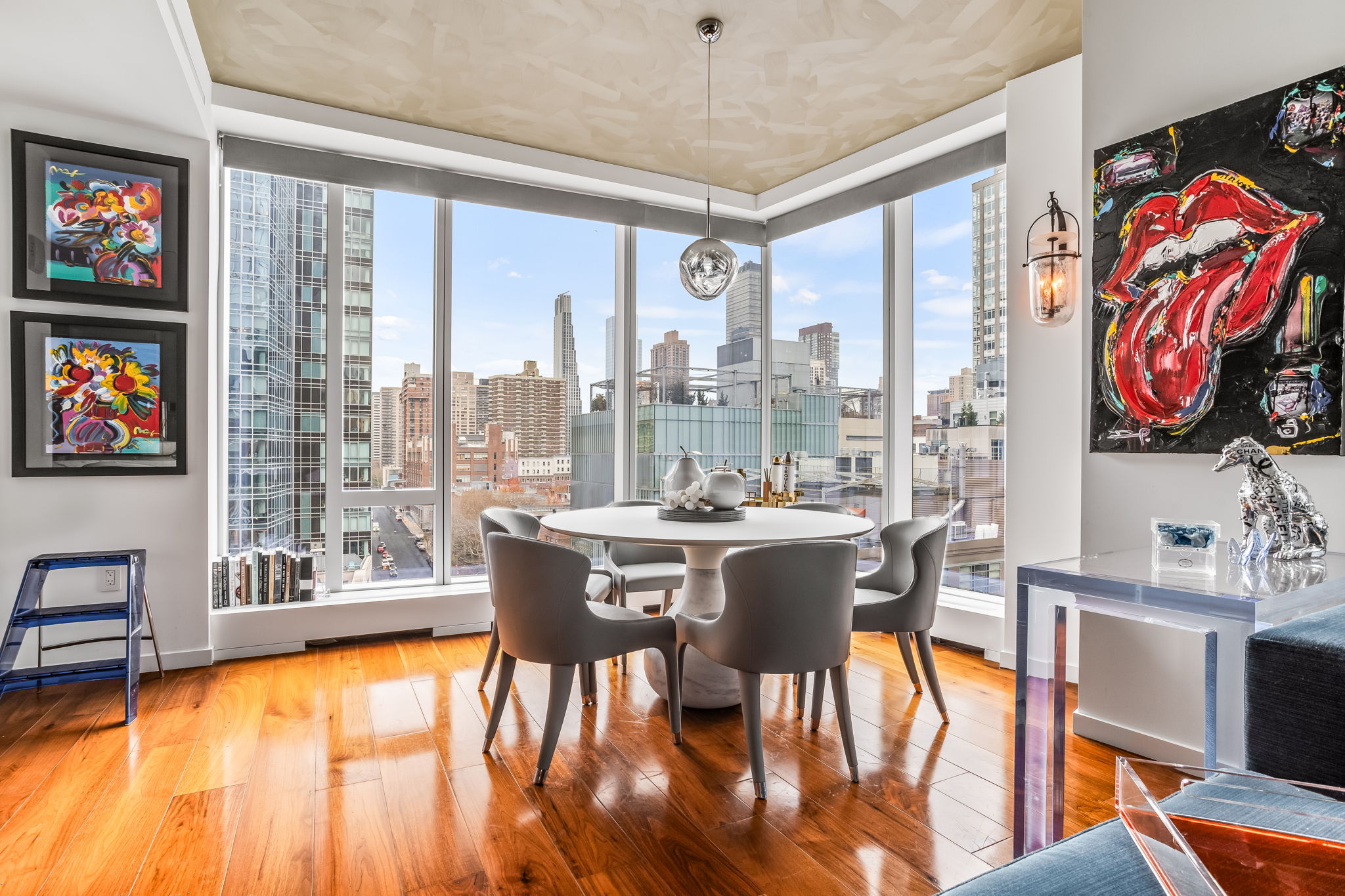 1 West End Avenue, Unit 9D Manhattan, NY 10023 - Photo 6 of 22 a dining room with furniture a chandelier and wooden floor