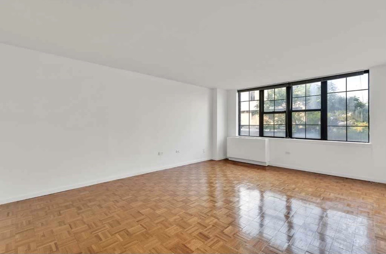 222 West 14th Street, Unit 5D Manhattan, NY 10011 - Photo 2 of 9 a view of an empty room with a window