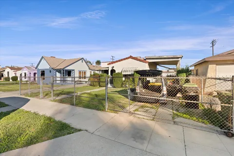 a view of house with swimming pool outdoor seating
