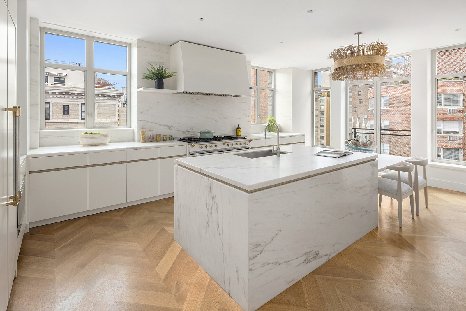1228 Madison Avenue, Unit 10 Manhattan, NY 10128 - Photo 10 of 21 a kitchen with stainless steel appliances granite countertop a stove a sink and a refrigerator