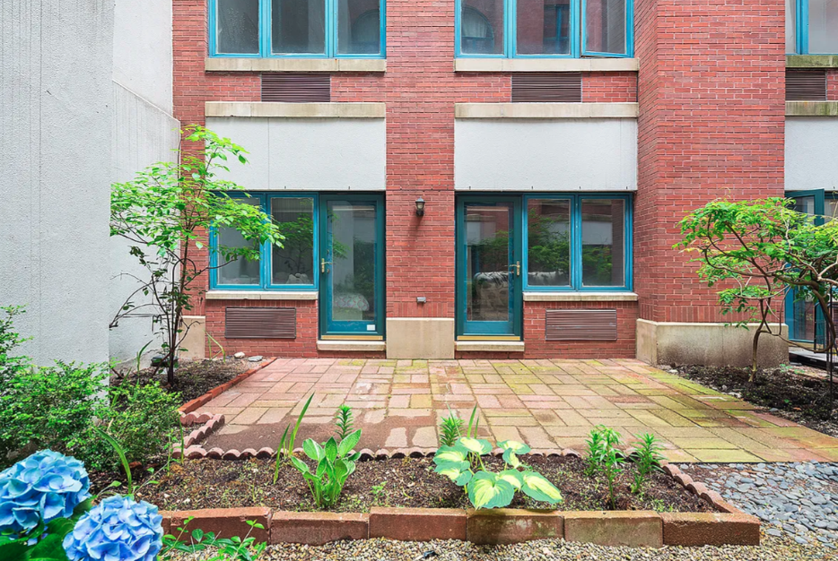 125 East 12th Street, Unit 1E Manhattan, NY 10003 - Photo 15 of 16 a front view of a house with garden