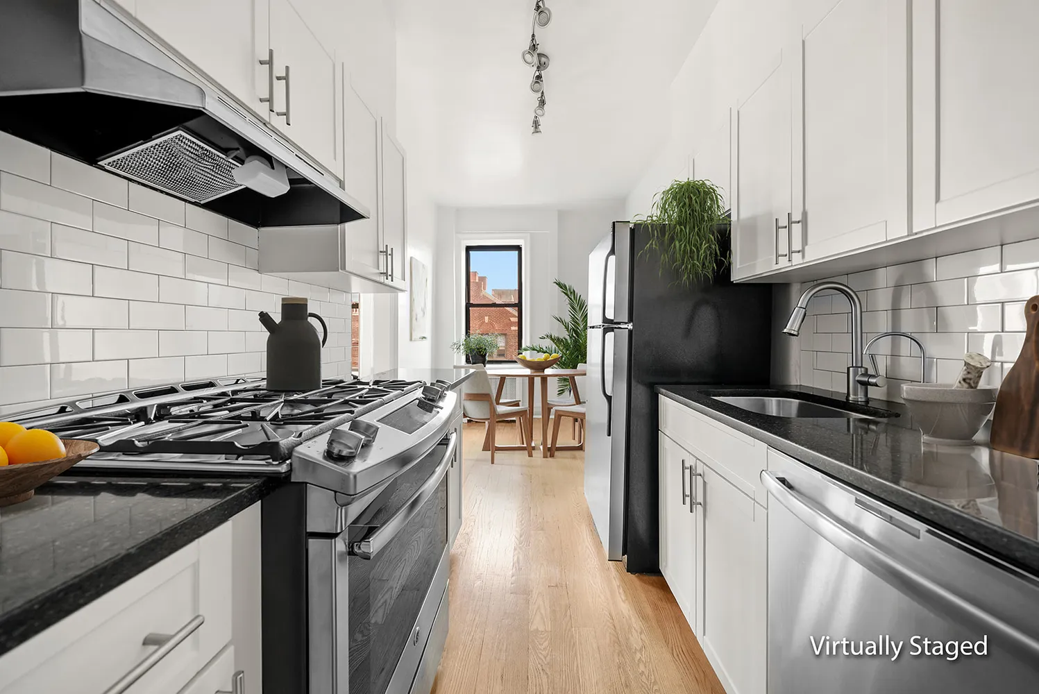 a kitchen with stainless steel appliances granite countertop a stove and a sink