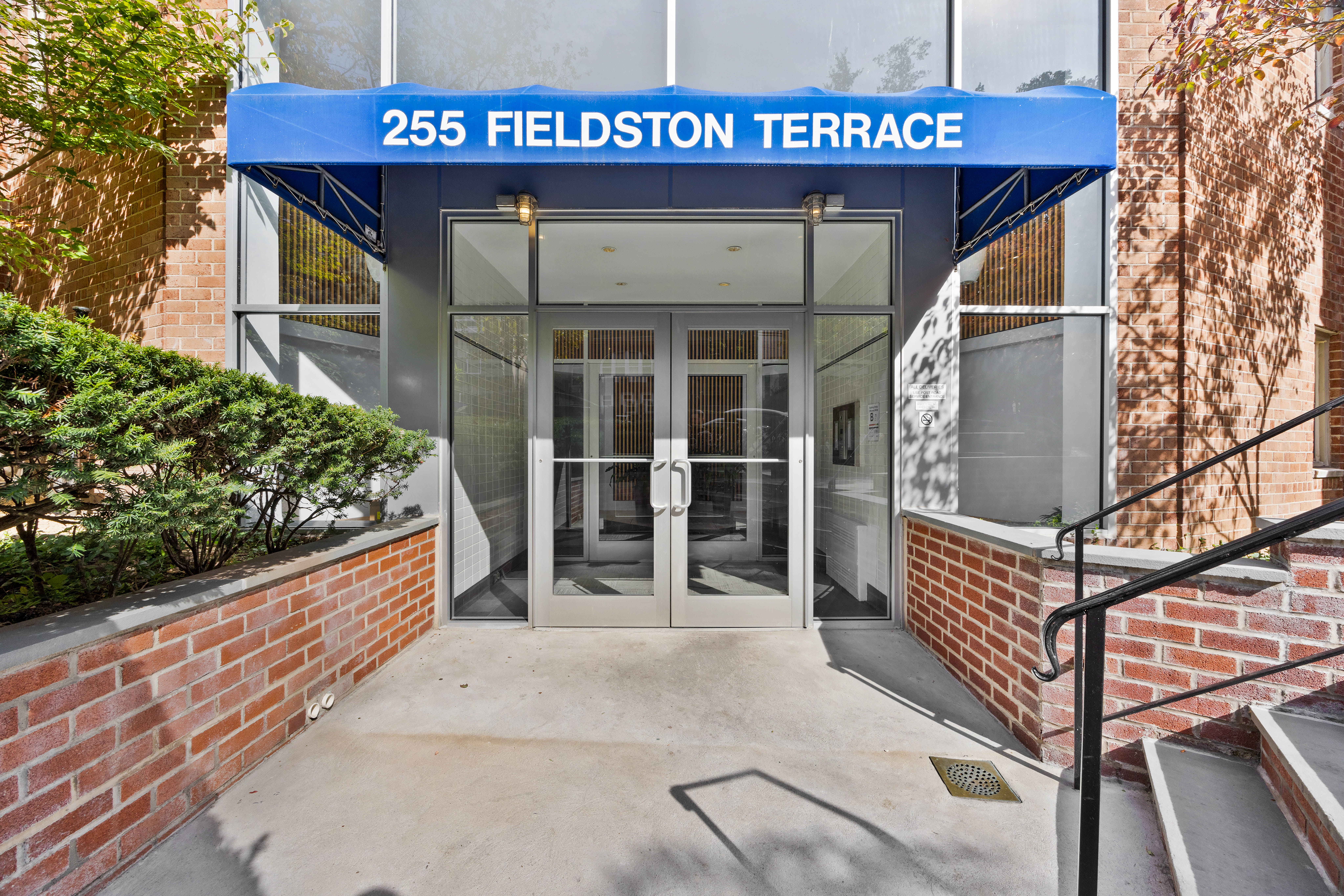 255 Fieldston Terrace, Unit 2L Bronx, NY 10471 - Photo 31 of 32 a view of a house with a wooden deck