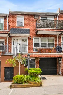 a front view of a house with garage