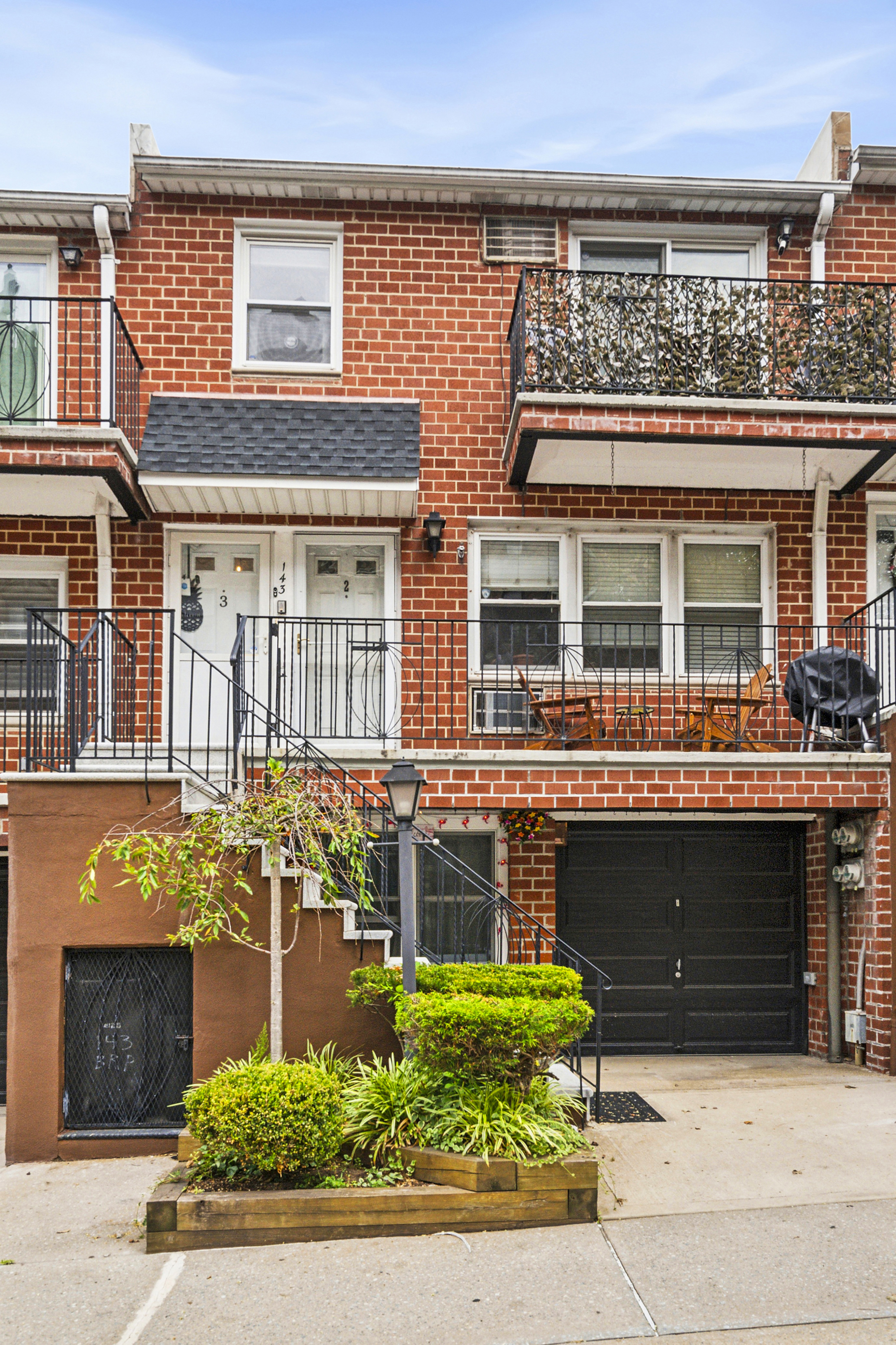 143 Bay Ridge Parkway, Unit 3 Brooklyn, NY 11209 - Photo 2 of 12 a front view of a house with garage