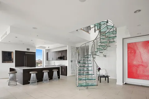 a view of entryway and kitchen