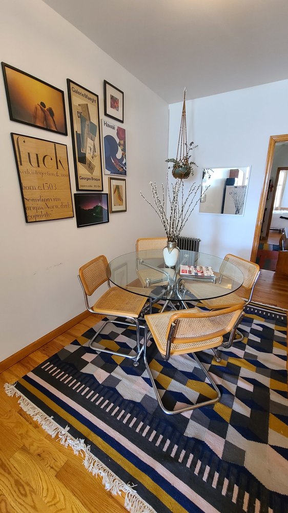 a bedroom with furniture and wooden floor