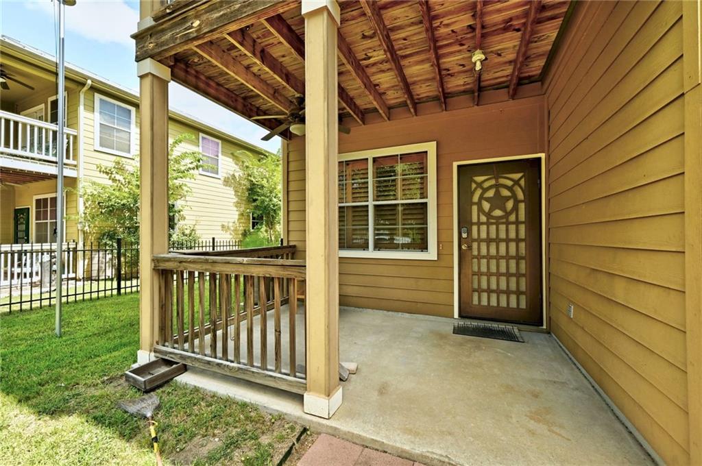 1102 Clermont Avenue Austin, TX 78702 - Photo 8 of 30 a view of a porch with a door and a porch