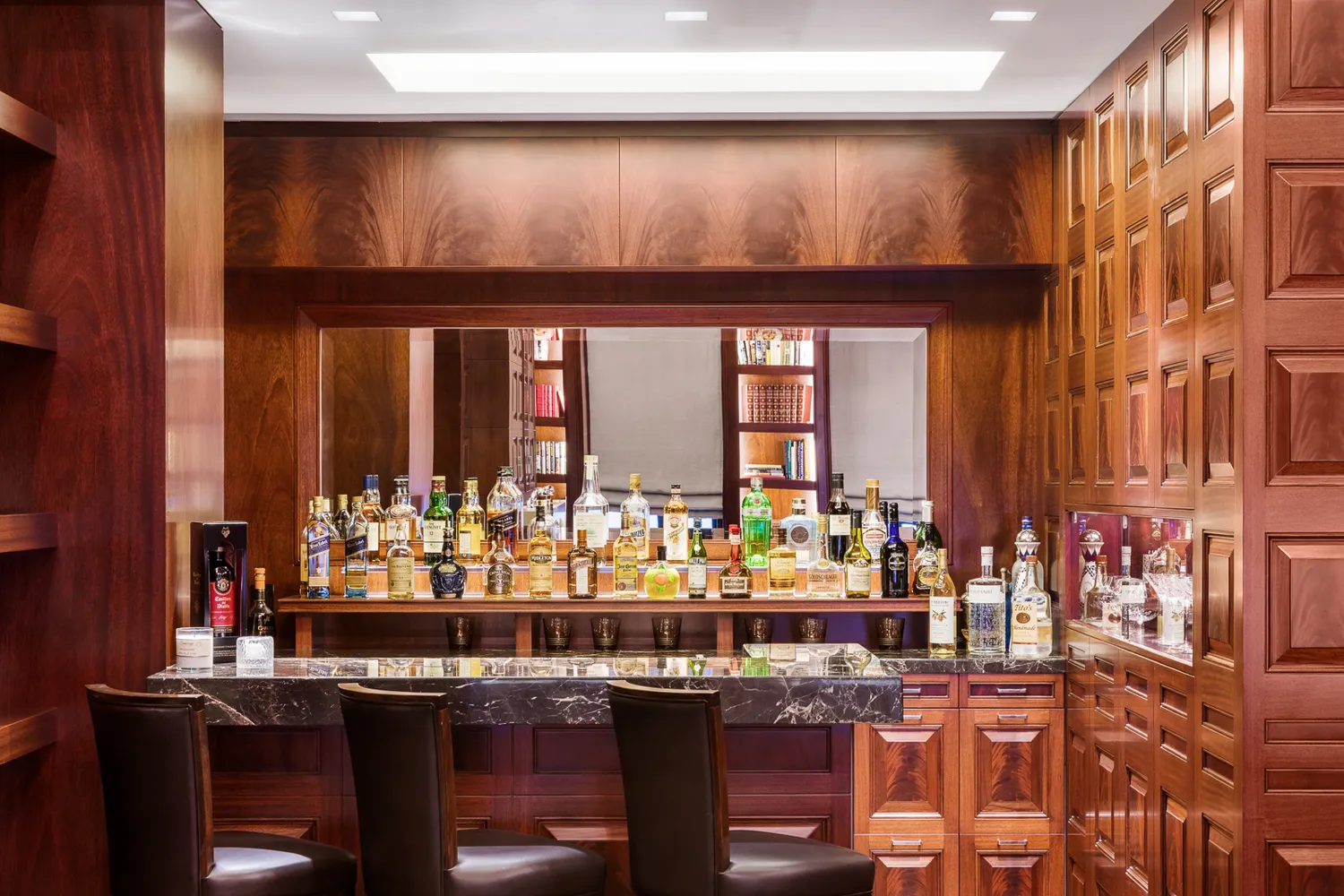 a bedroom with a bed wooden floor and window