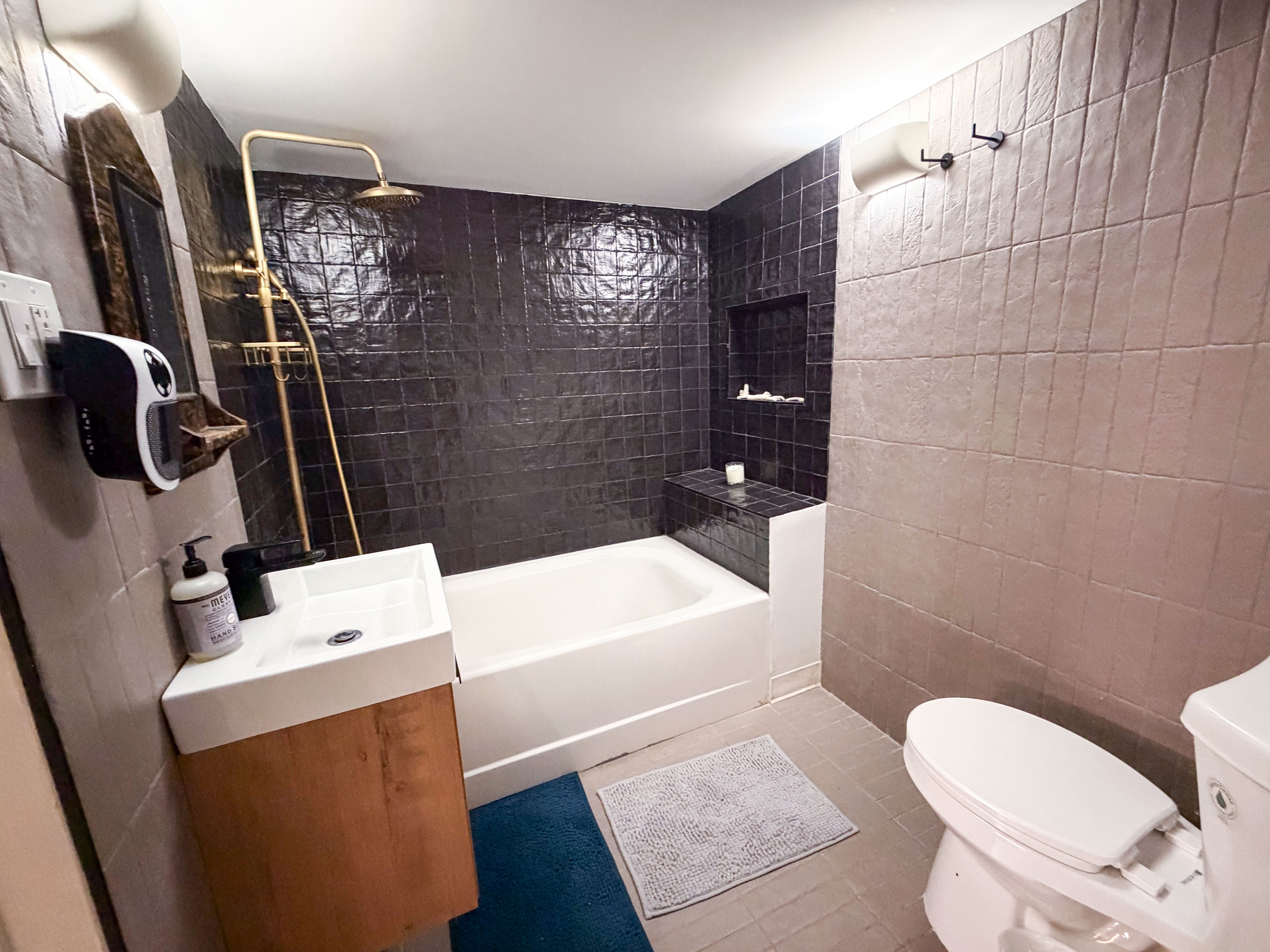206 East 7th Street, Unit G Manhattan, NY 10009 - Photo 12 of 22 a bathroom with a sink a toilet and shower