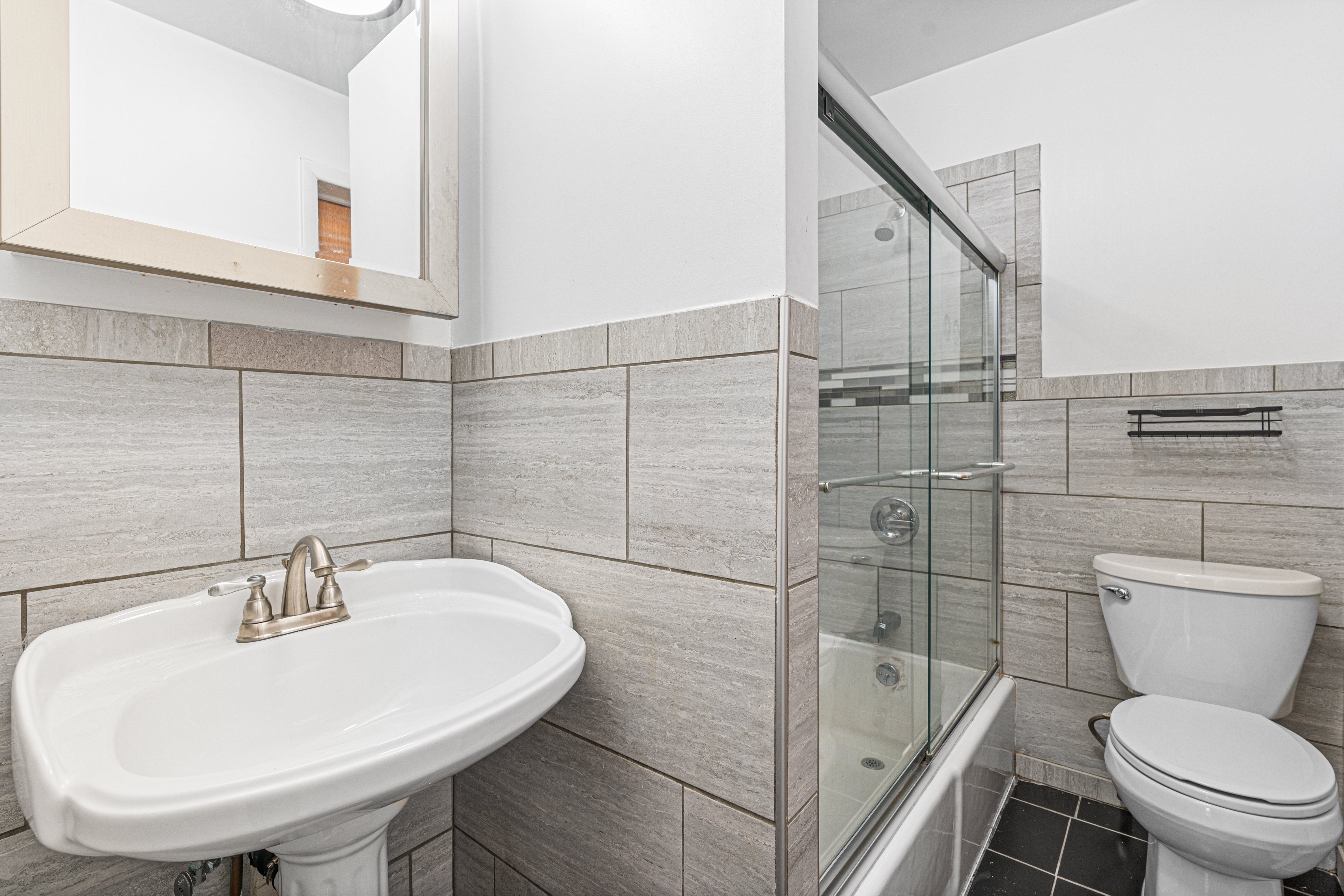 51 Herkimer Street, Unit 2 Brooklyn, NY 11216 - Photo 8 of 10 a bathroom with a sink toilet and shower