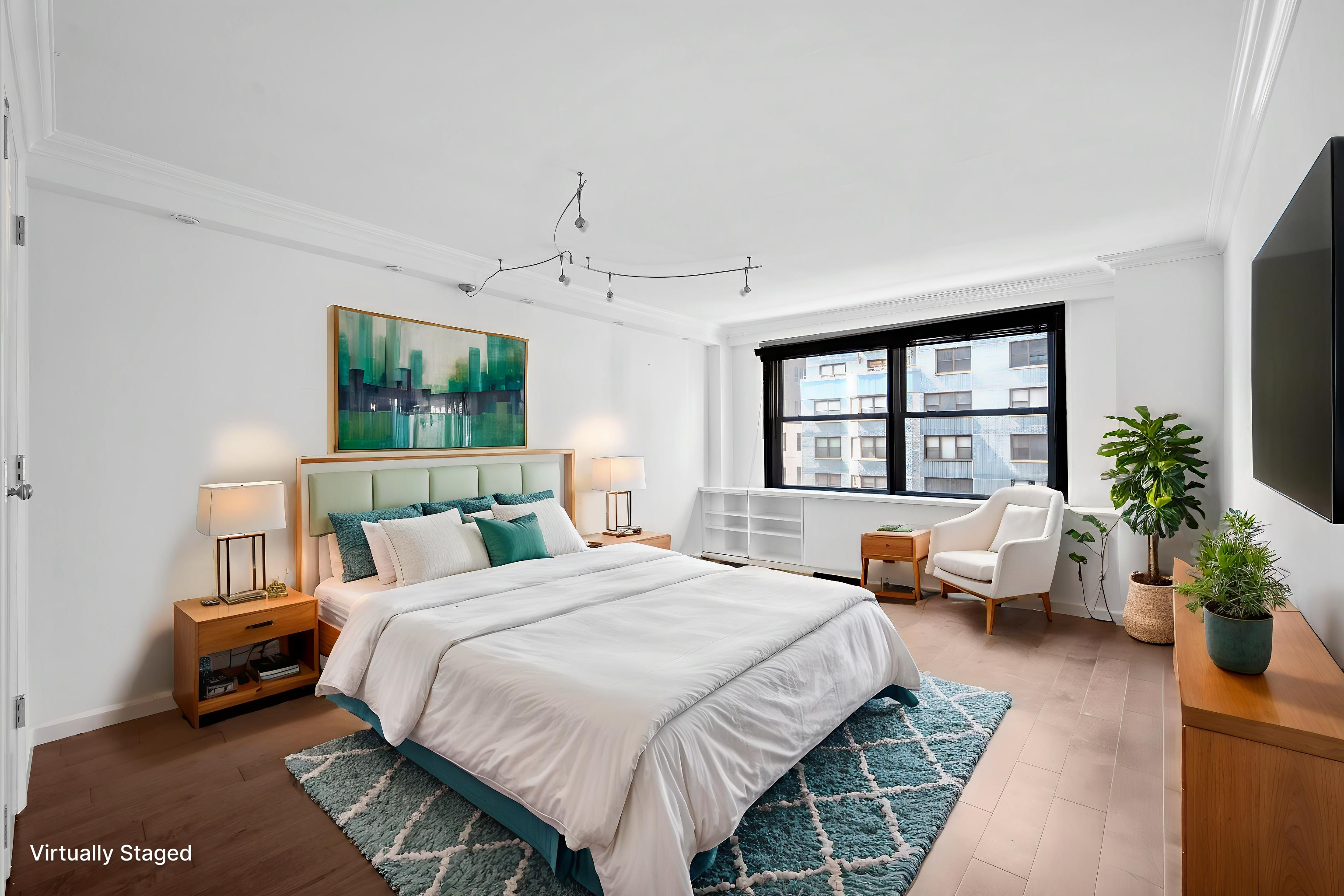 225 East 57th Street, Unit 14F Manhattan, NY 10022 - Photo 9 of 14 a bedroom with a bed and a couch