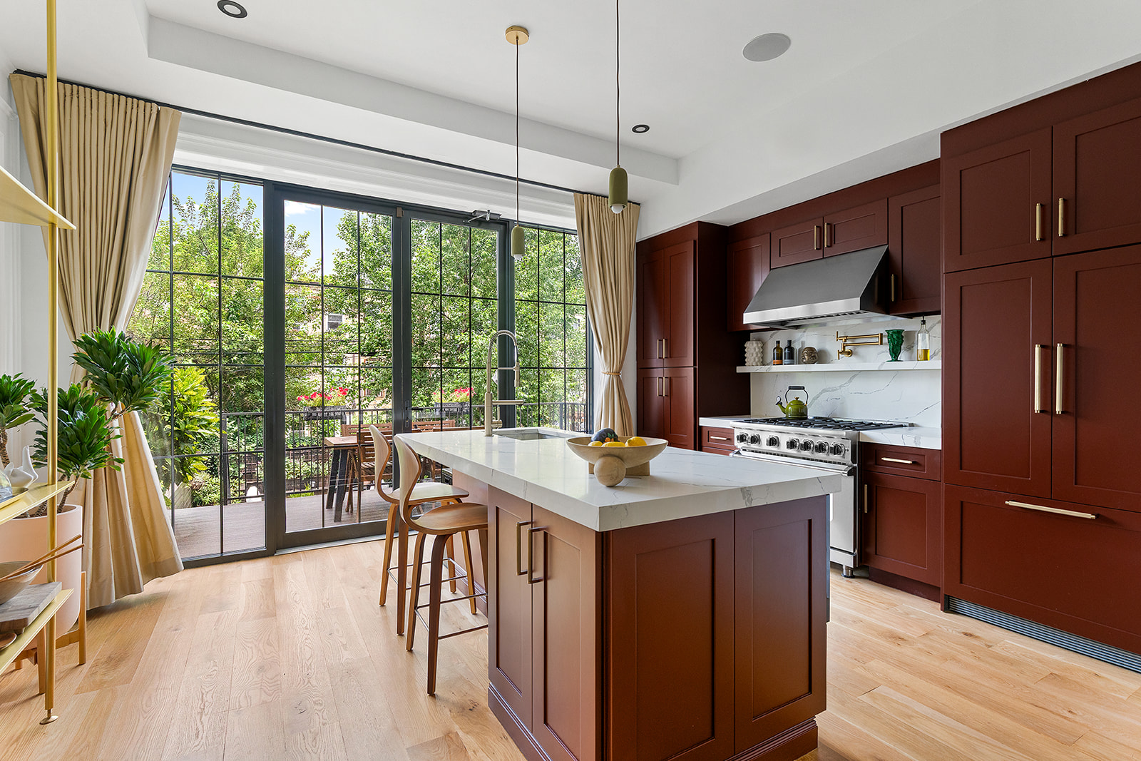 533 Decatur Street Brooklyn, NY 11233 - Photo 6 of 21 a kitchen with stainless steel appliances granite countertop a stove a refrigerator a sink and a dining table with wooden floor