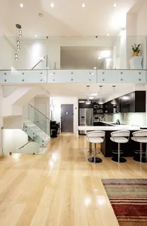 a large kitchen with a table and chairs in it