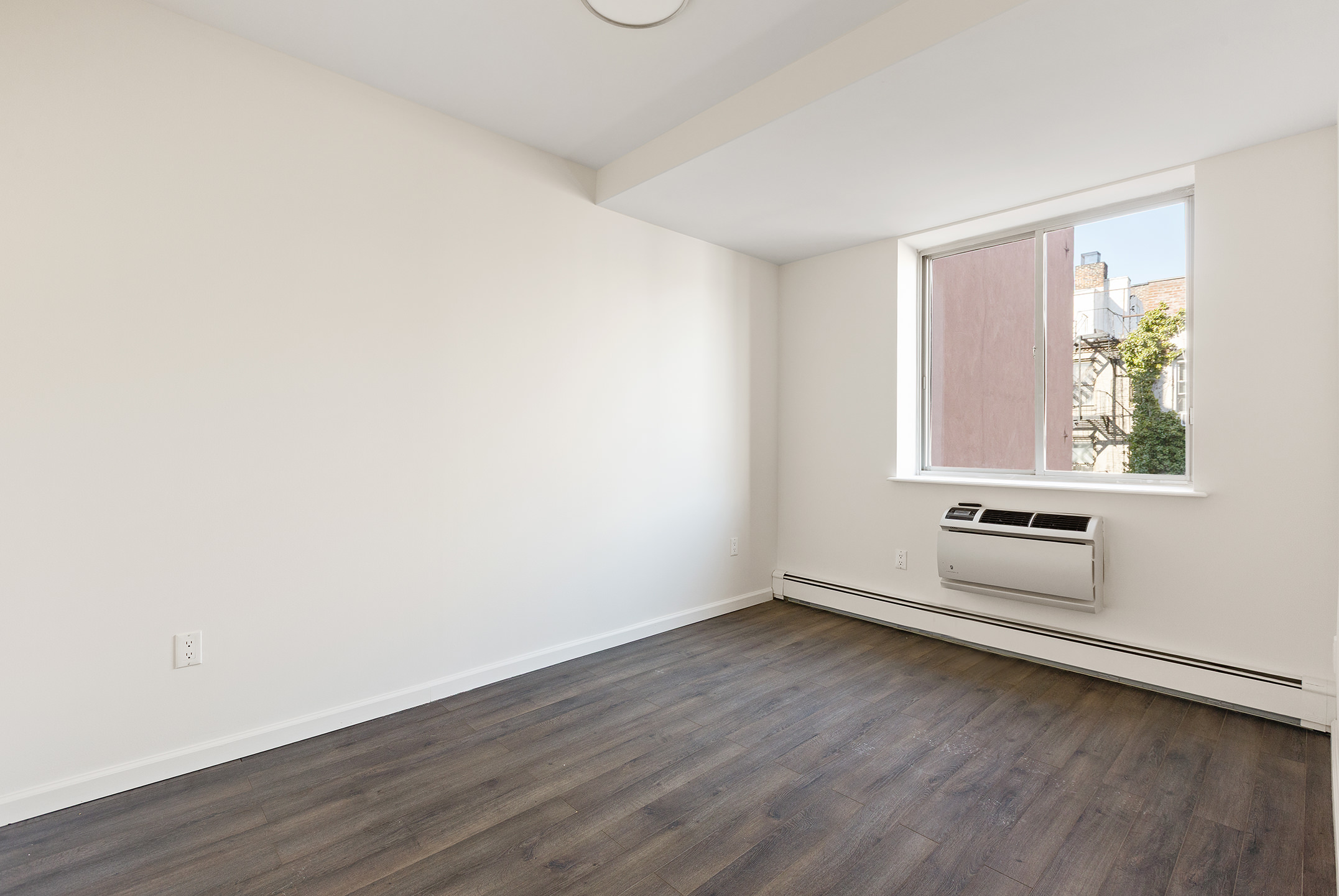 194 East 2nd Street, Unit 4A Manhattan, NY 10009 - Photo 2 of 13 an empty room with a window