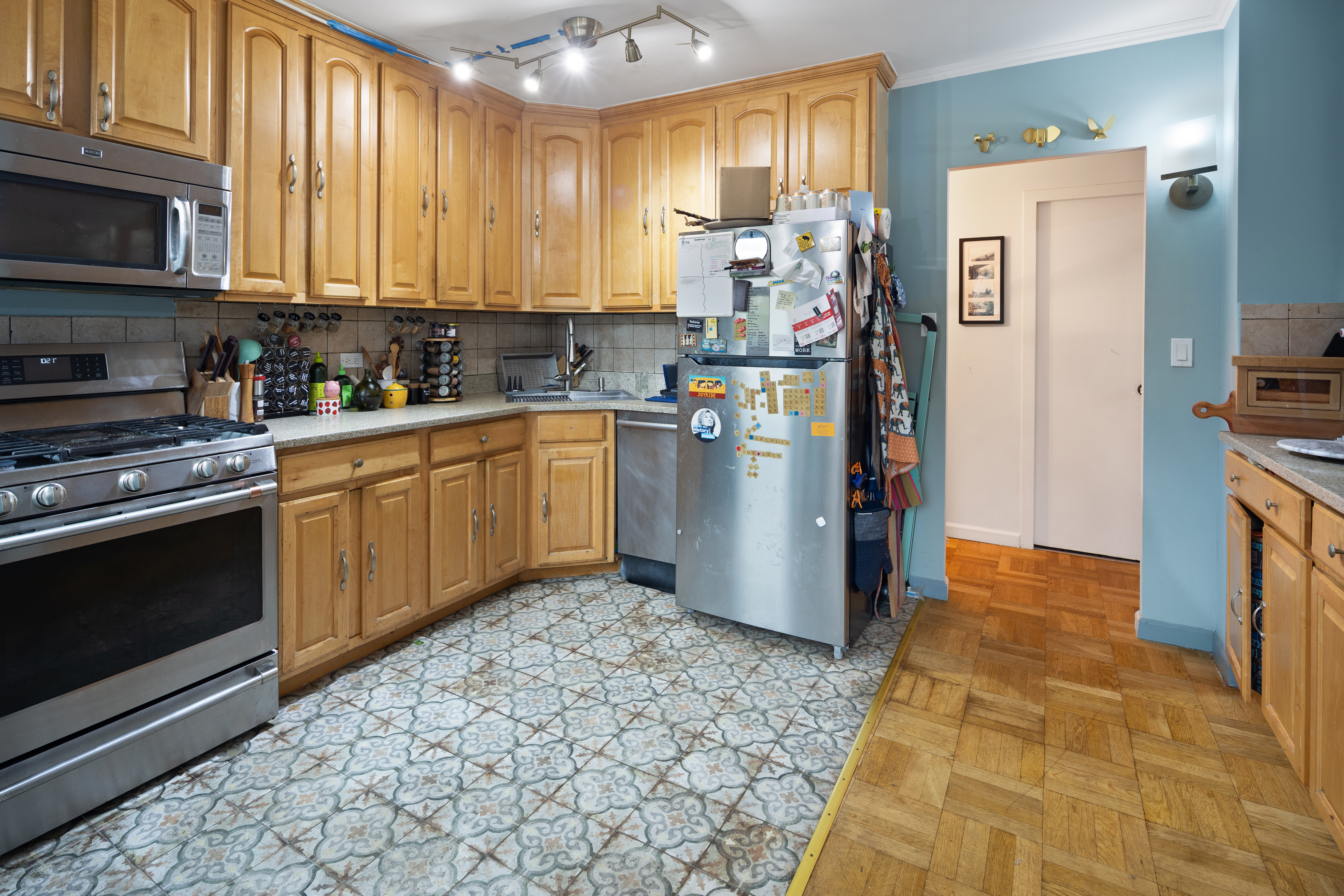 210 Clinton Avenue, Unit 4B Brooklyn, NY 11205 - Photo 4 of 8 a kitchen with stainless steel appliances granite countertop a stove a refrigerator and a sink