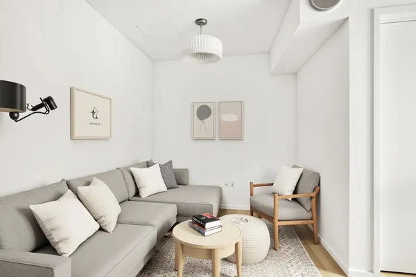 a living room with furniture and a chair