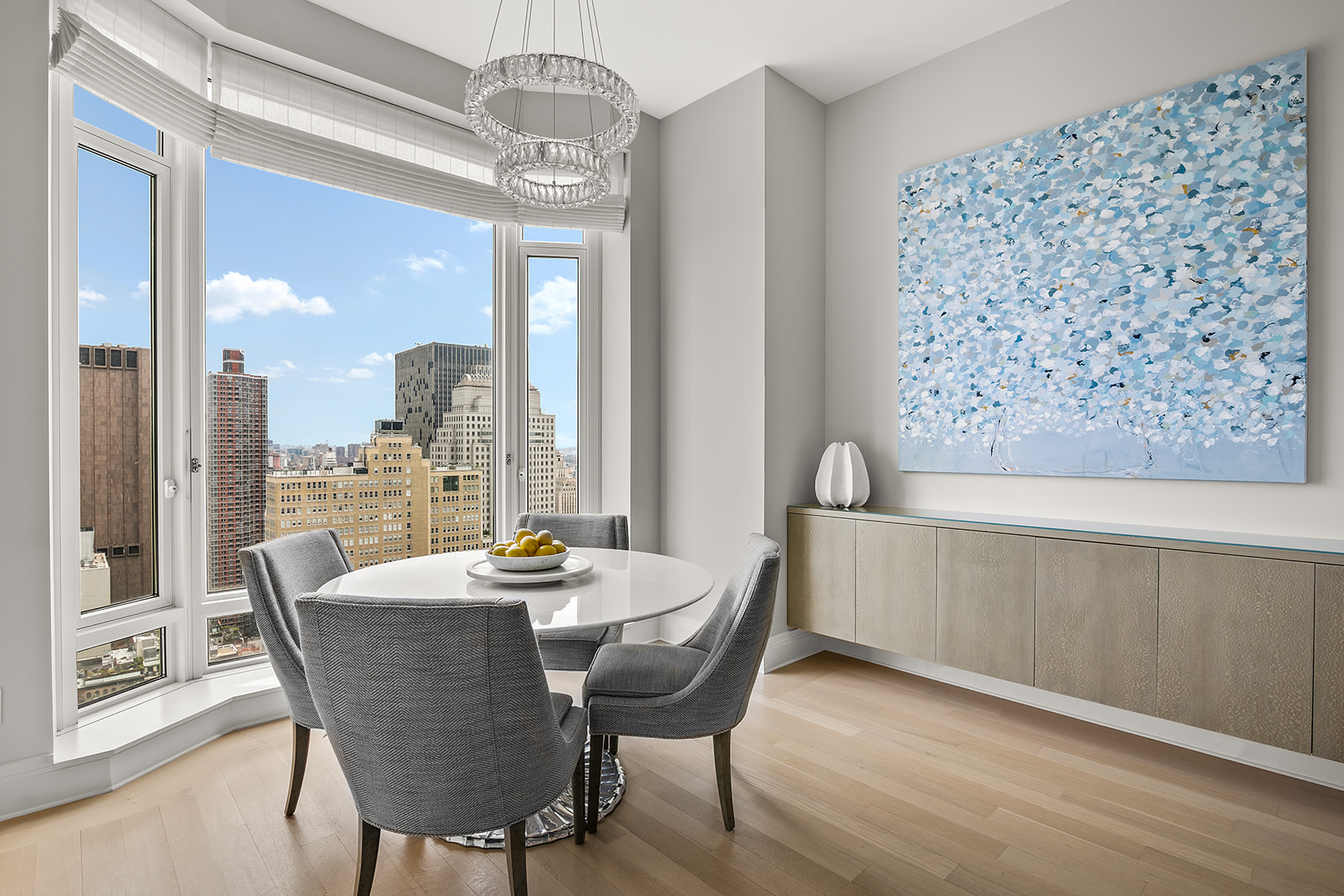 30 Park Place, Unit 43A Manhattan, NY 10007 - Photo 3 of 13 a dining room with furniture a chandelier and wooden floor
