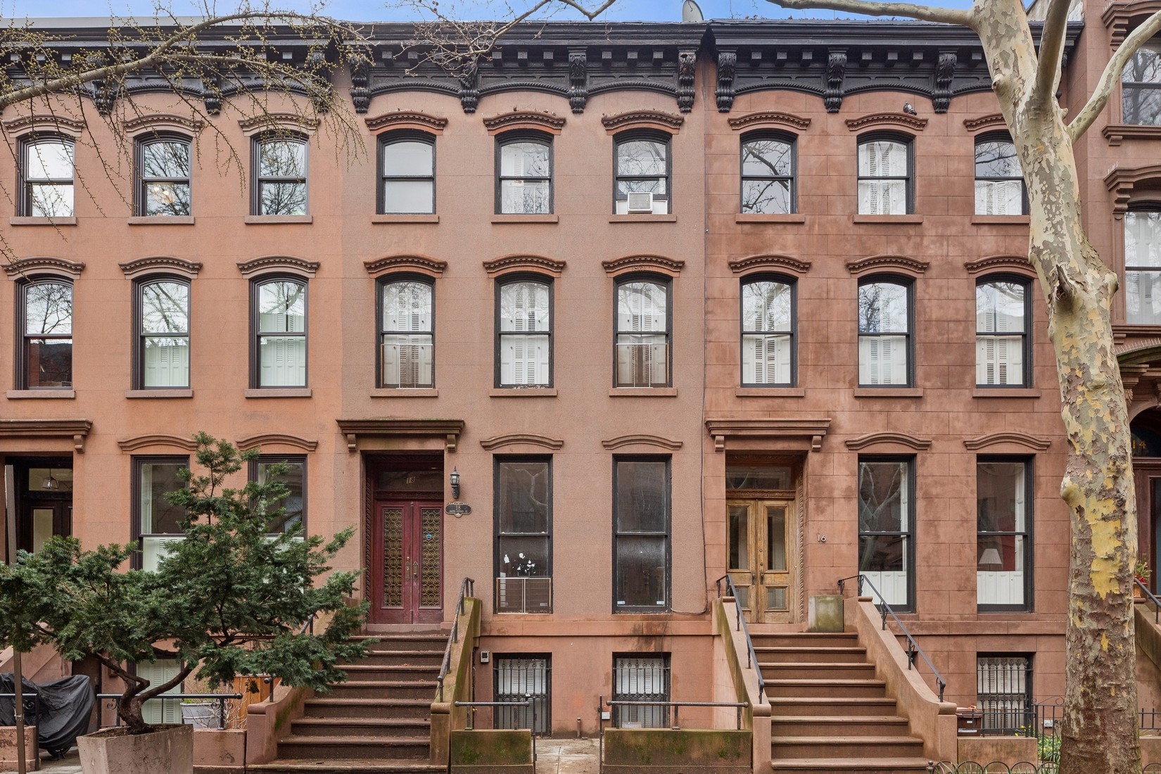 front view of a brick building with a lot of windows