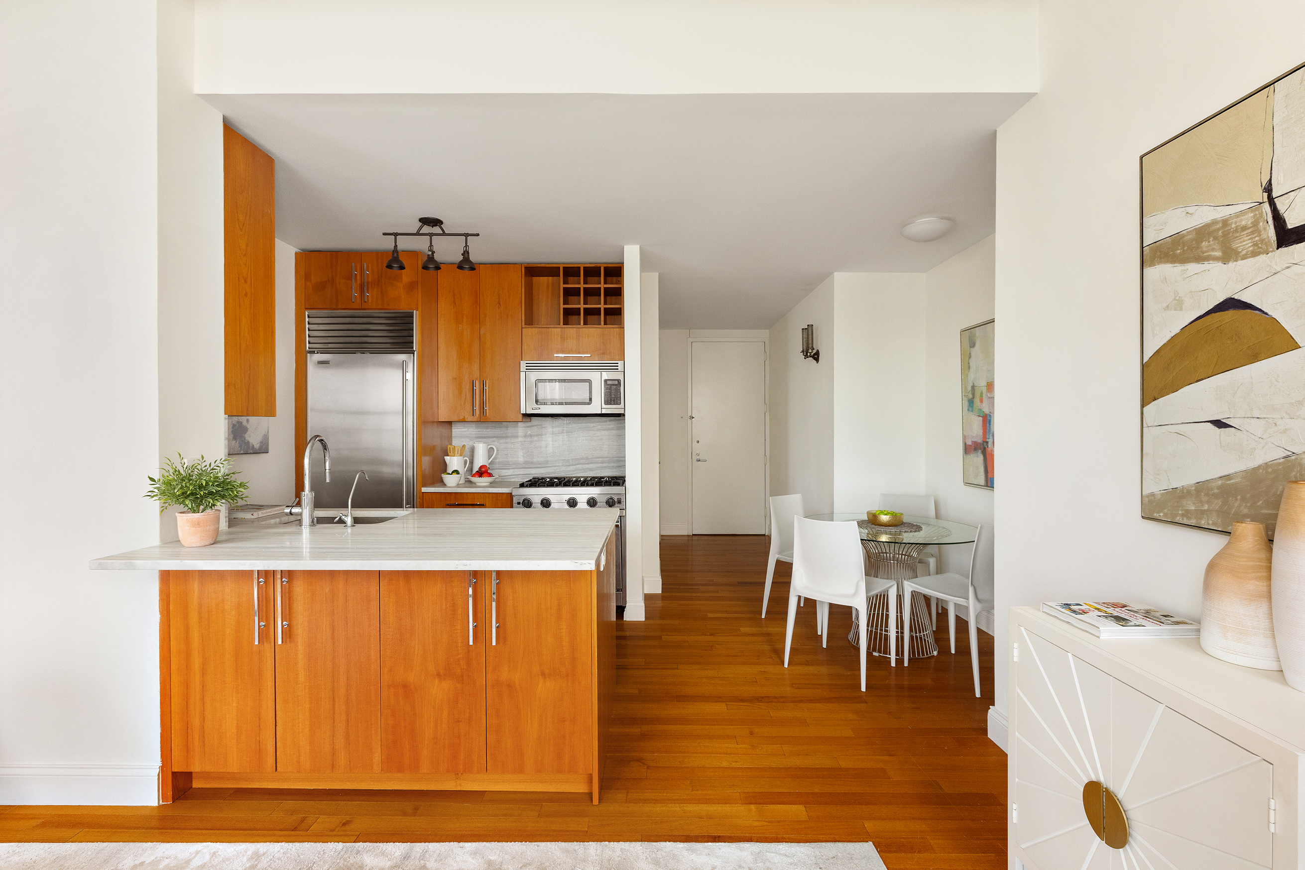 88 Greenwich Street, Unit 2206 Manhattan, NY 10006 - Photo 2 of 16 a living room with stainless steel appliances kitchen island granite countertop furniture and a large window