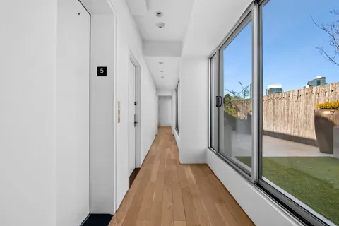 a view of gallery with wooden floor