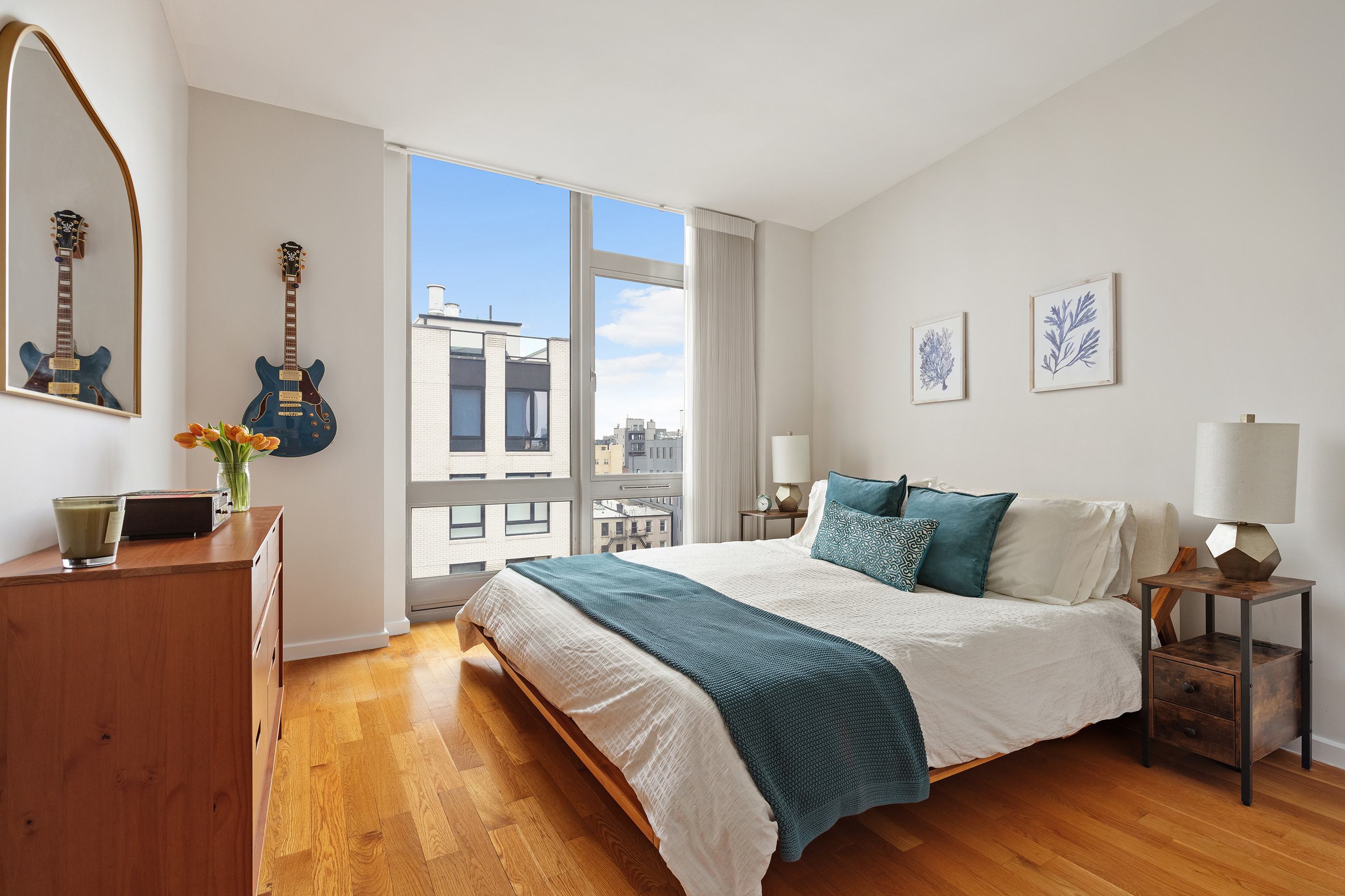 82 Irving Place, Unit 7C Brooklyn, NY 11238 - Photo 7 of 16 a bedroom with a bed and wooden floor