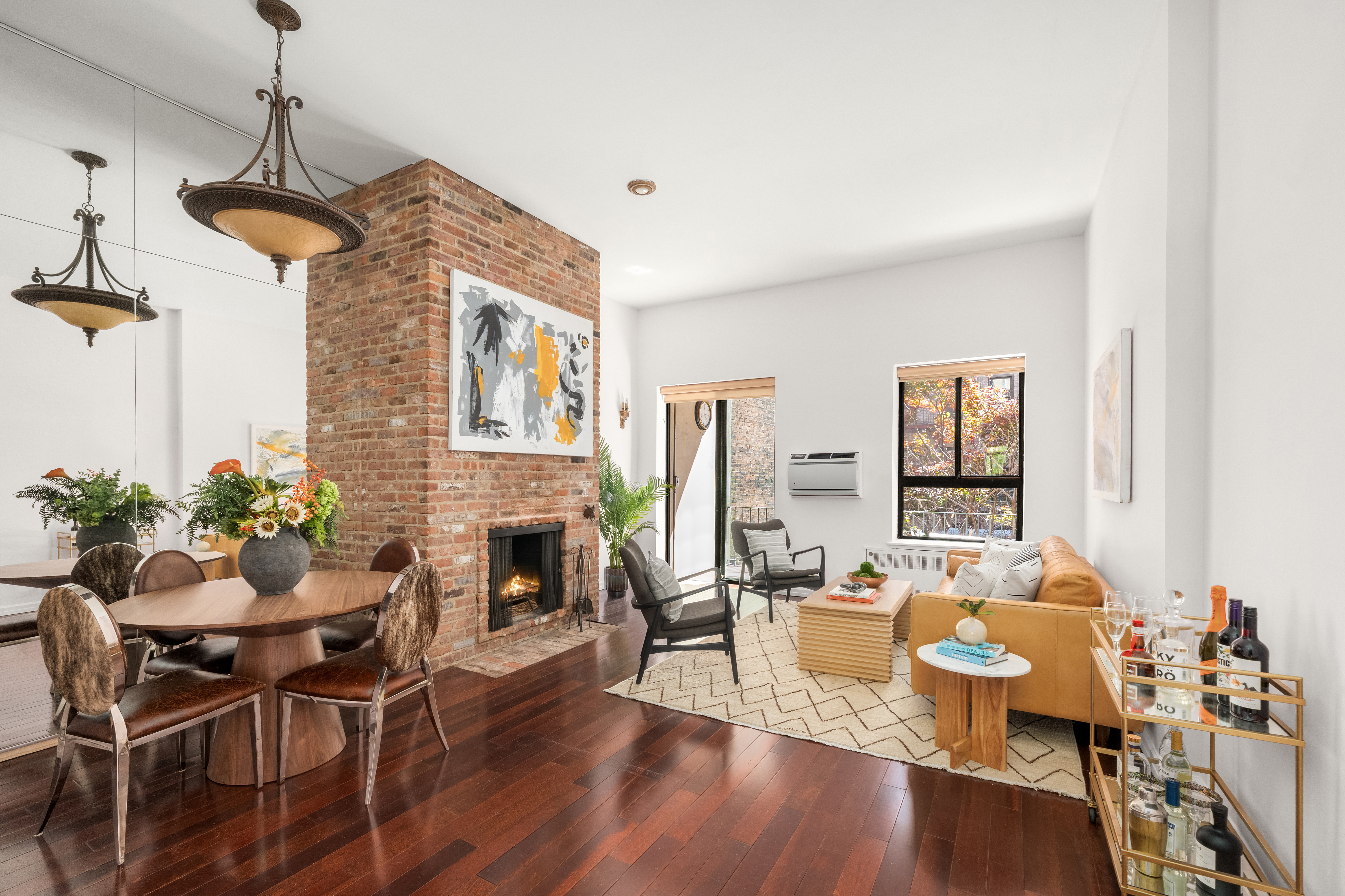228 West 21st Street, Unit 2 Manhattan, NY 10011 - Photo 1 of 9 a living room with furniture fireplace and potted plants