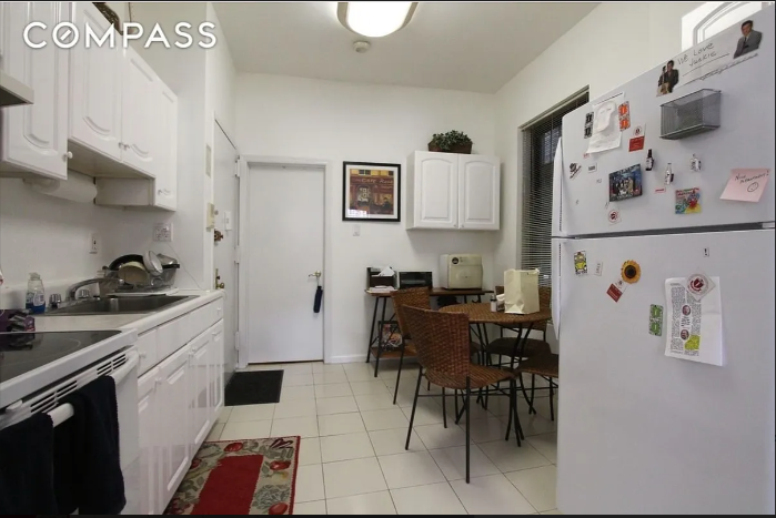 1313 3rd Avenue, Unit 3RN Manhattan, NY 10021 - Photo 2 of 7 a kitchen with stainless steel appliances a stove a sink and a refrigerator