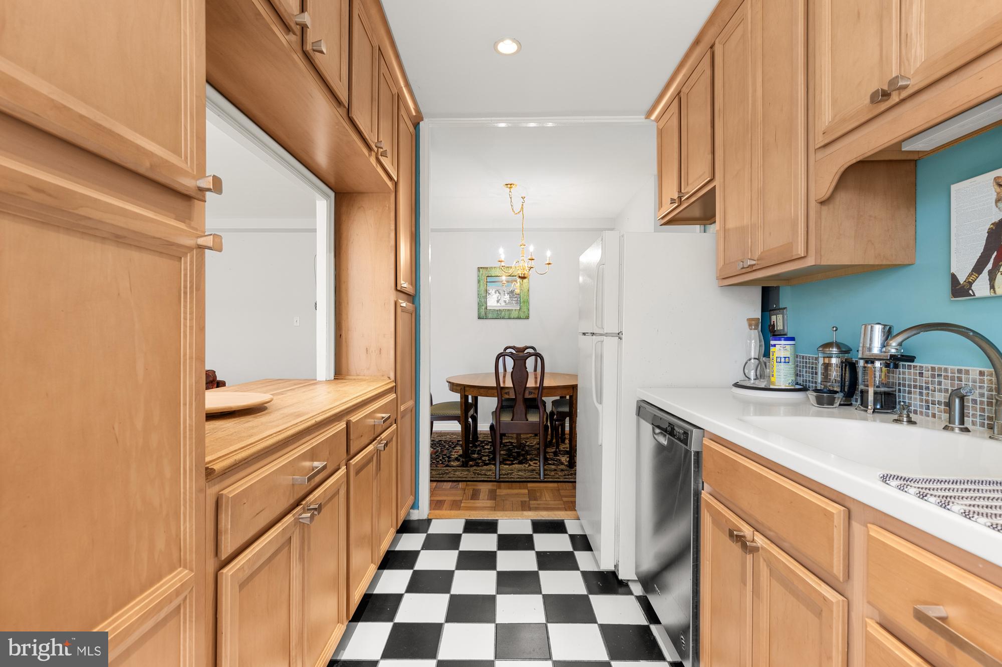 4100 W Street Northwest, Unit 314 Washington, DC 20007 - Photo 14 of 28 a kitchen with a sink a stove and refrigerator