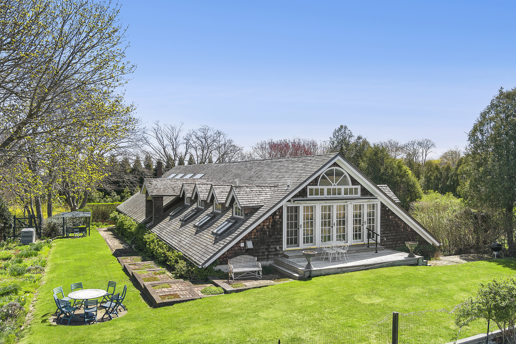 488 Ocean Road Bridgehampton, NY 11932 - Photo 2 of 21 a view of a house with a yard