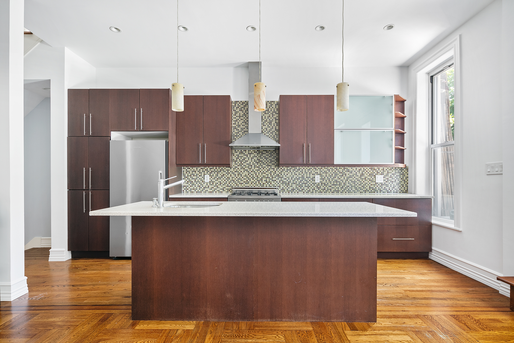 428 5th Street Brooklyn, NY 11215 - Photo 3 of 26 a kitchen with stainless steel appliances granite countertop a sink a refrigerator and a granite counter tops