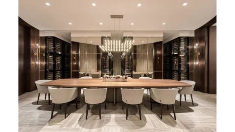 a large dining space with furniture a chandelier and wooden floor