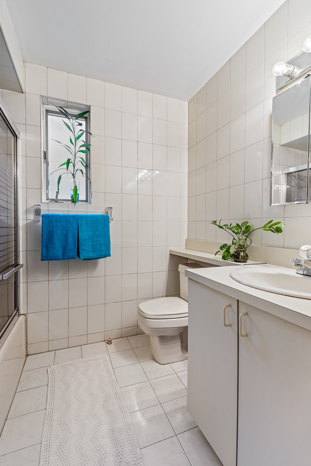 181 Terrace Place Brooklyn, NY 11218 - Photo 16 of 22 a bathroom with a sink a toilet and mirror
