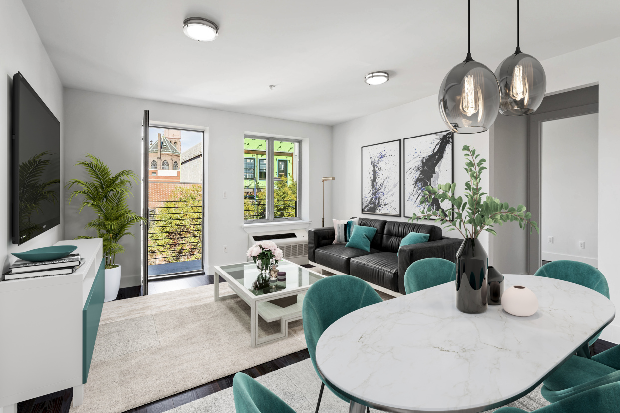 a living room with furniture a large window and a flat screen tv