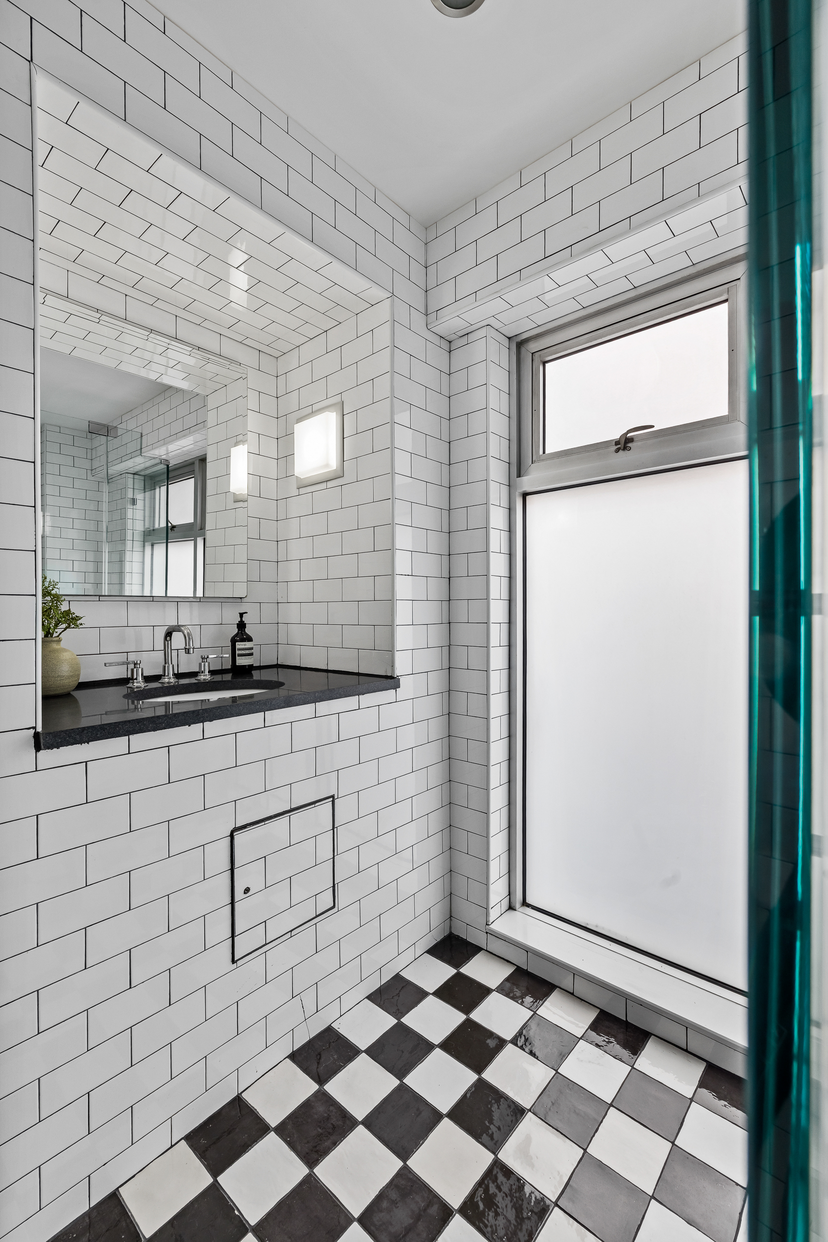 325 Bowery, Unit PH Manhattan, NY 10003 - Photo 11 of 17 a bathroom with a sink mirror and shower