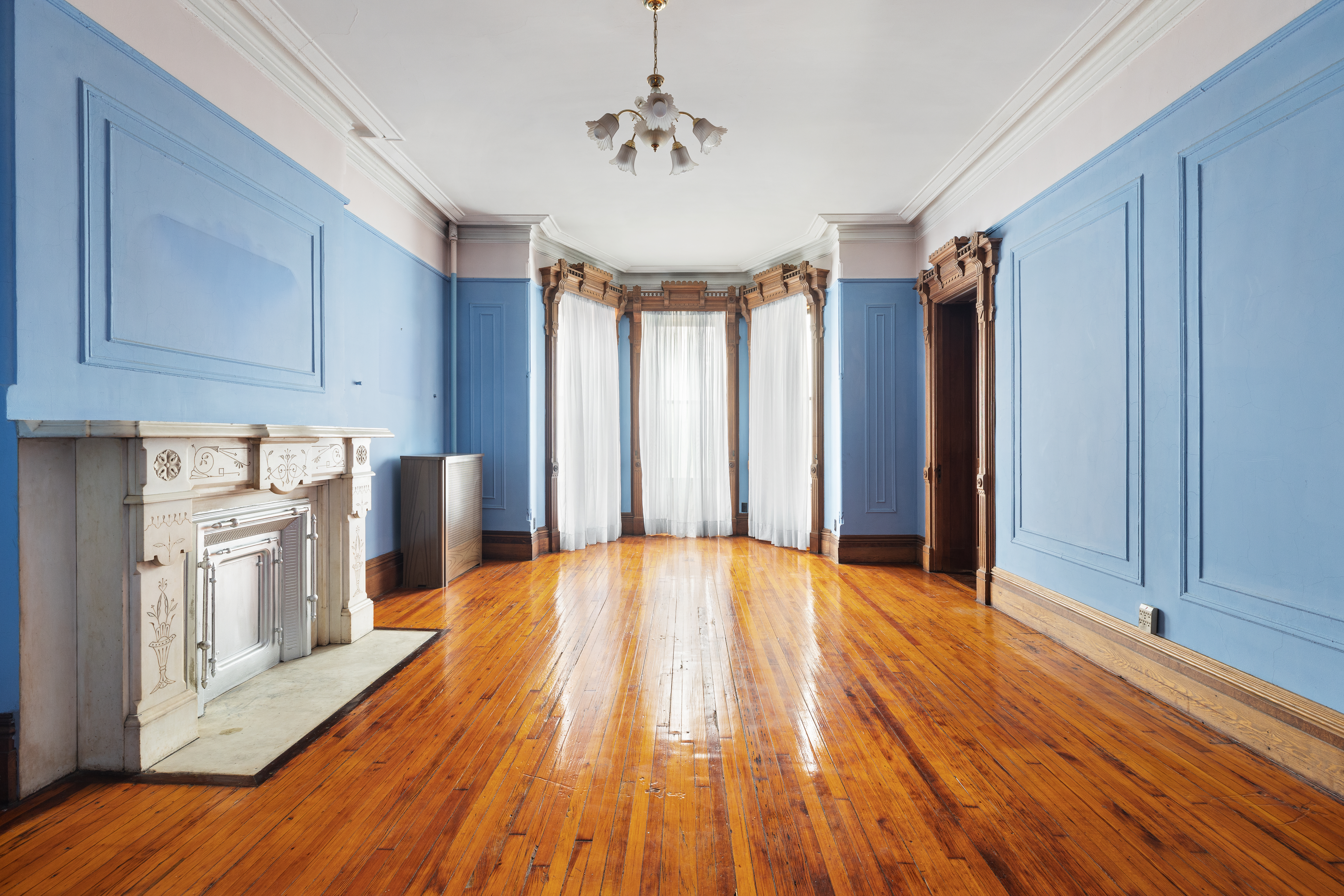 34 Mt Morris Park West Manhattan, NY 10027 - Photo 8 of 15 a view of empty room with wooden floor and fan