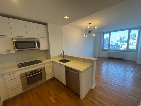 a kitchen with a stove and a microwave