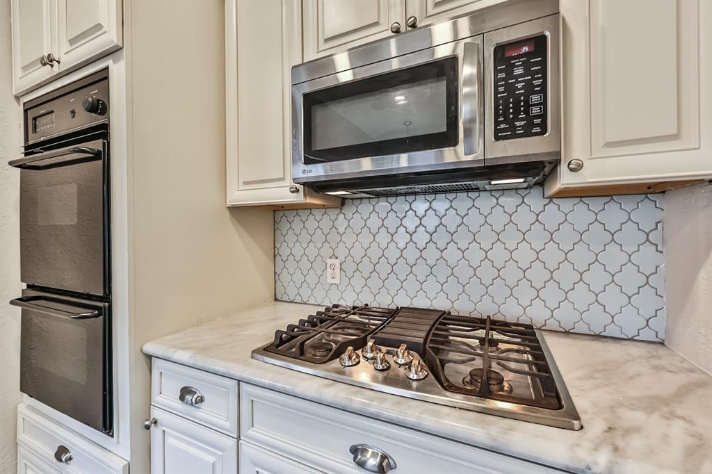 1120 Winston Street Houston, TX 77009 - Photo 14 of 29 a stove top oven sitting inside of a kitchen