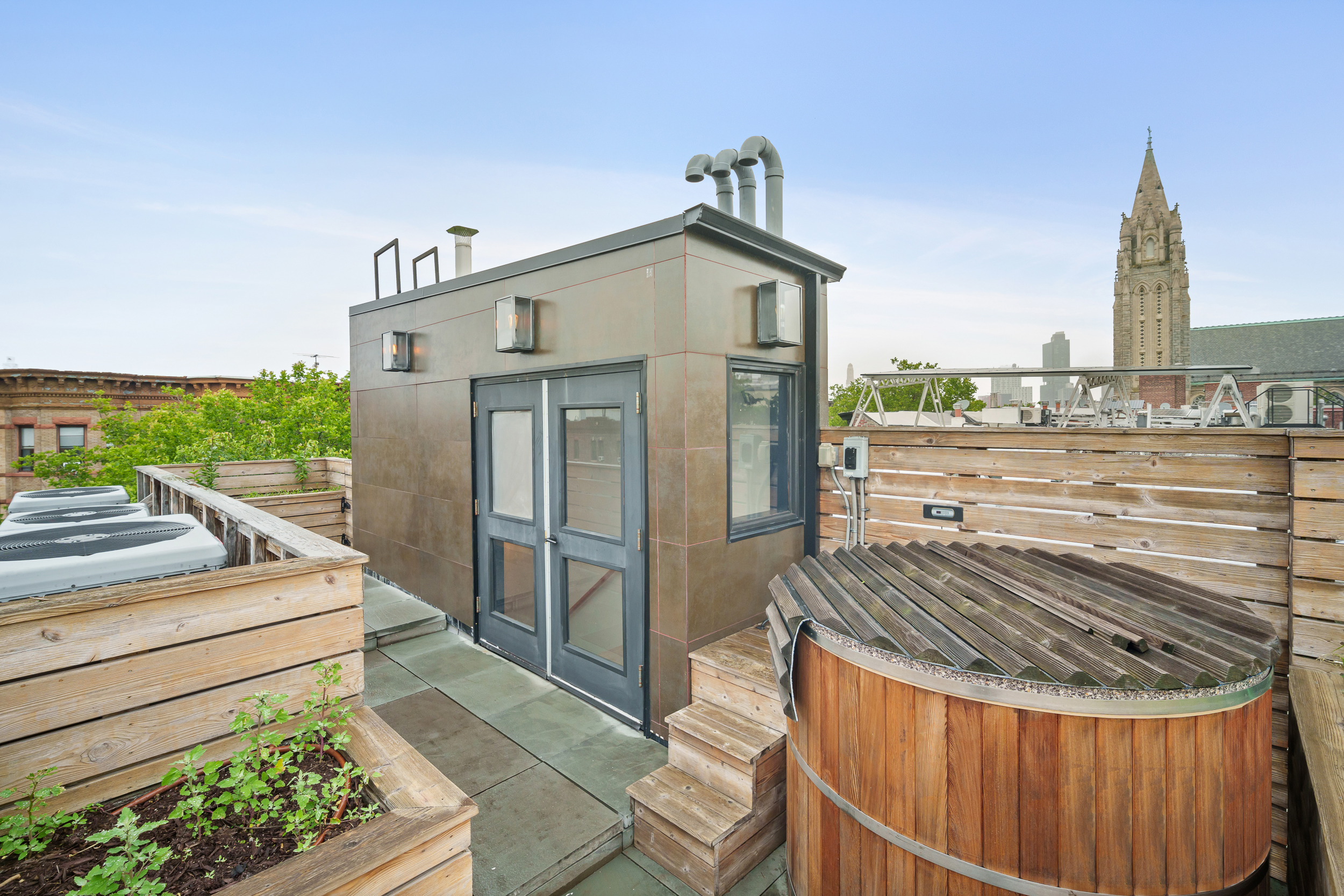 265 6th Avenue Brooklyn, NY 11215 - Photo 22 of 24 a view of a house with backyard and deck