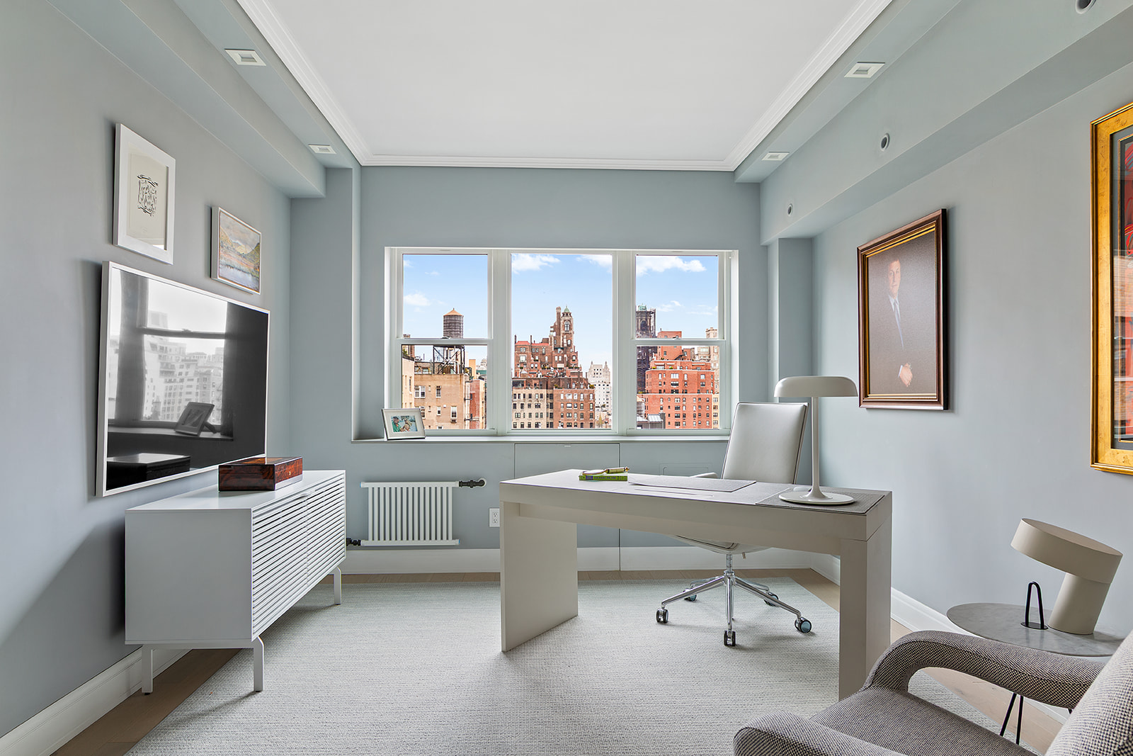 165 East 72nd Street, Unit 17L Manhattan, NY 10021 - Photo 6 of 12 a room with furniture and windows