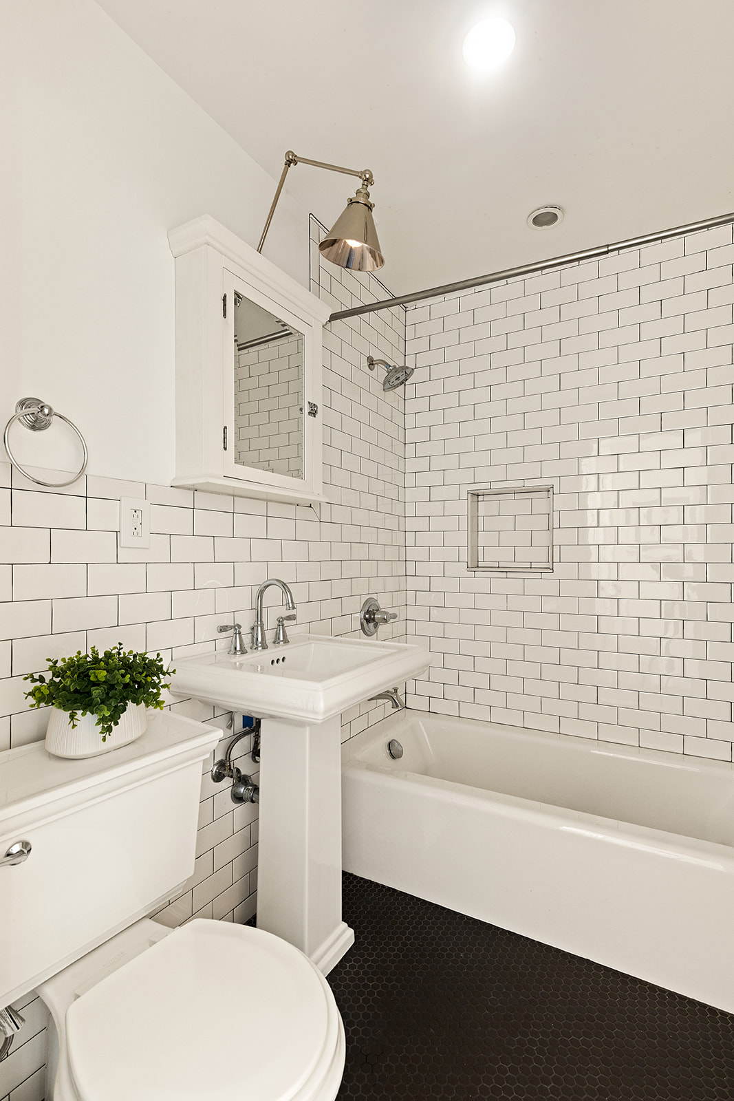 300 West 108th Street, Unit 2C Manhattan, NY 10025 - Photo 11 of 16 a bathroom with a sink a toilet and bathtub