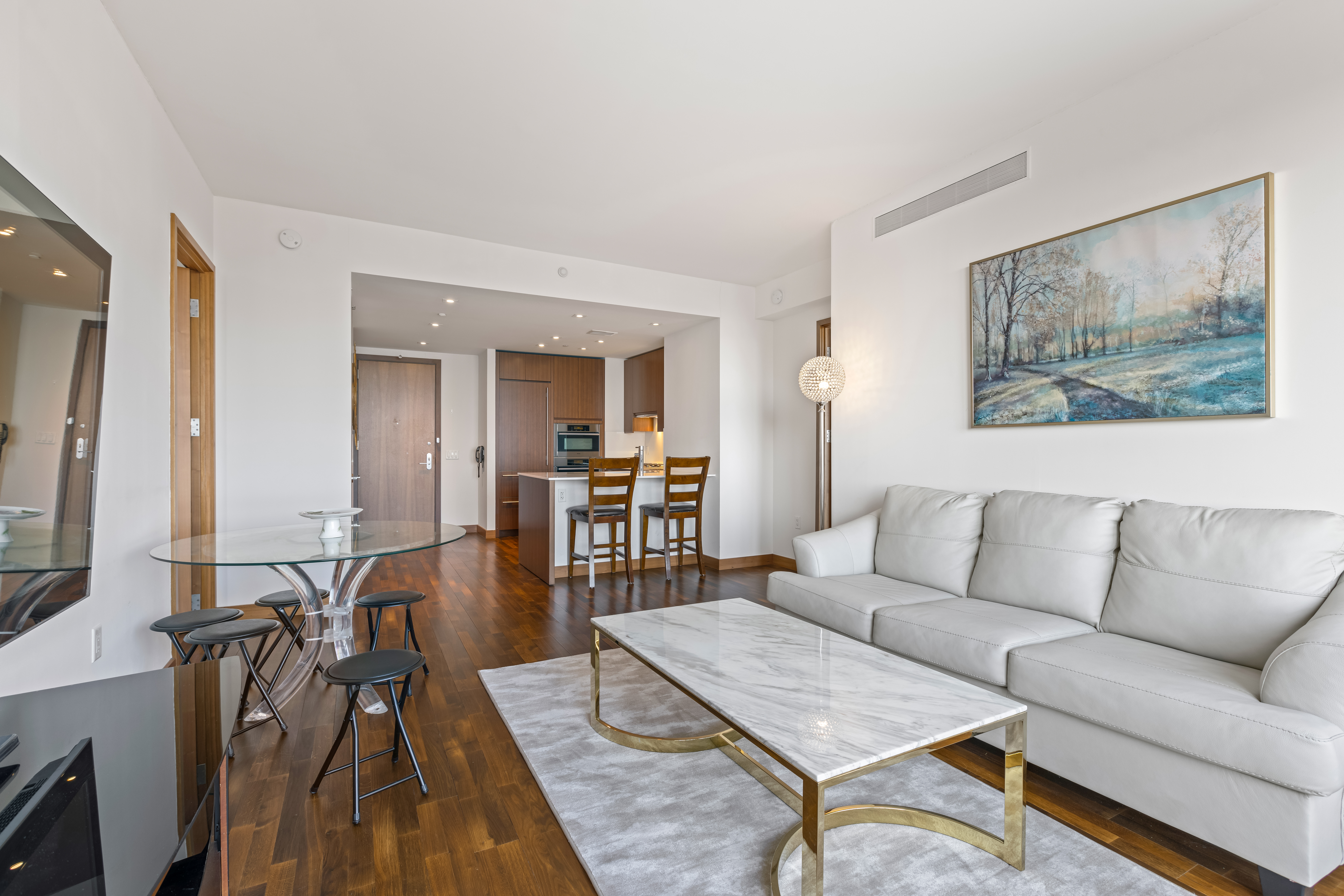 400 5th Avenue, Unit 49C Manhattan, NY 10018 - Photo 3 of 21 a living room with furniture and a flat screen tv