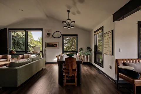 a view of a dining room with furniture and window