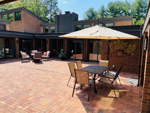 a patio with table and chairs