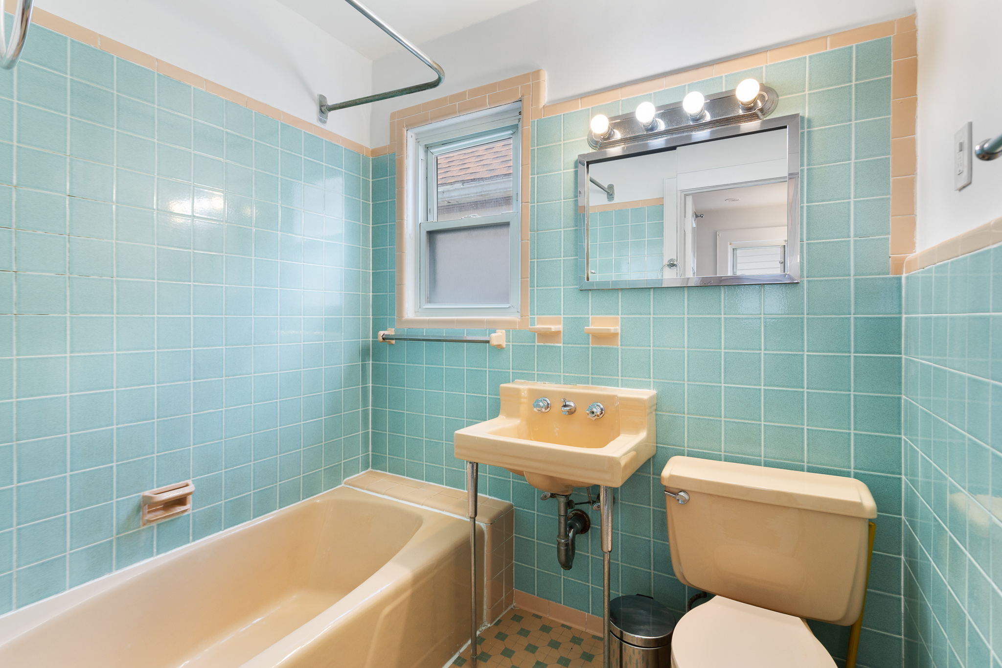 91-22 92nd Street Queens, NY 11421 - Photo 12 of 27 a bathroom with a sink a toilet and a mirror